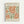 Framed vintage-style art poster featuring abstract organic shapes in terracotta orange and sage green on cream background. Text reads "MATISSE PAPIERS DÉCOUPÉS" at top and "BERGGRUEN & CIE" with Paris gallery address below the flowing, cut-paper inspired design. Light wood frame against white wall.