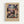 Framed exhibition poster featuring Paul Klee's abstract artwork "About a Motif from Hammamet" from 1914. The composition shows geometric blocks in muted colors including purple, pink, brown, yellow, and teal arranged in a mosaic-like pattern. Text at top reads "EXHIBITION ART - 1914" and bottom shows museum attribution and artist name in large letters. The poster has a cream background and is displayed in a light wood frame against a white wall.