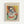 May include: Framed Picasso-style cubist portrait print displayed on white wall. Artwork features abstract female figure with geometric face in blue, yellow, and white tones against colorful orange, yellow, and green background. Light wood frame with cream matting. French text below image describes contemporary artistic creations inspired by Picasso's techniques and ideas.
