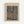 May include: Framed Paul Klee art print hanging on white wall in light wood frame. Abstract artwork features organic blue and beige shapes resembling stones or cells against brown background. Museum exhibition poster with cream matting and clean modern presentation.