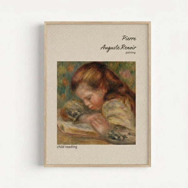 May include: Framed art print displaying a Pierre Auguste Renoir painting of a young child with reddish-brown hair reading a book. The child wears a light-colored dress and is shown in Renoir's characteristic soft, impressionistic style with warm tones. The print features cream matting with black text identifying the artist and subject, housed in a natural wood frame against a white wall.