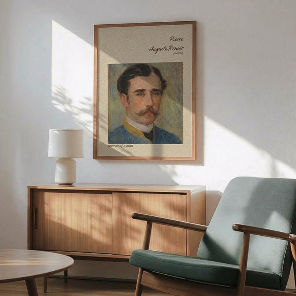 May include: Framed poster featuring a painted portrait of a man with dark hair and mustache wearing a blue jacket with yellow collar. The artwork is displayed above a wooden sideboard with table lamp in a modern living room setting with mint green upholstered chair and round coffee table. Warm natural lighting creates shadows across white walls.