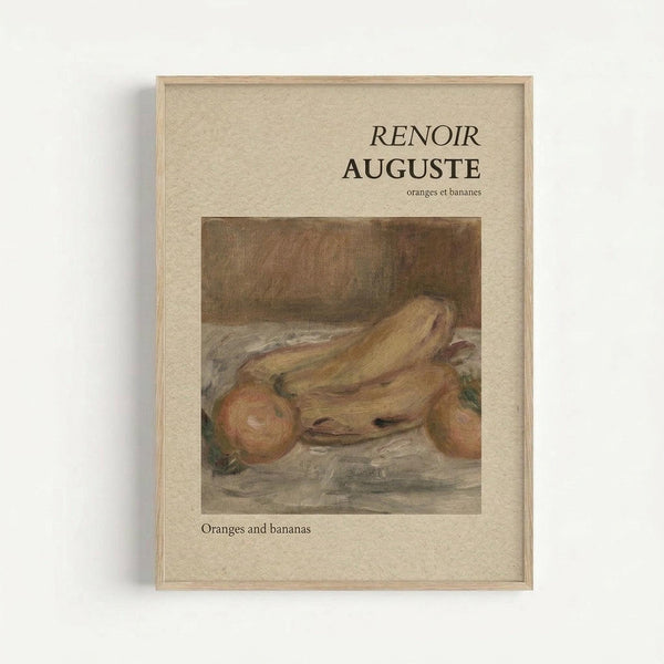 Framed art print featuring a Renoir still life painting of oranges and bananas in warm yellow and orange tones. The artwork shows fruit arranged on a table with soft, impressionistic brushstrokes. Text reads "RENOIR AUGUSTE" at top and "oranges et bananes" below, with "Oranges and bananas" in English at bottom. Displayed in a light wooden frame against a cream textured background on a white wall.