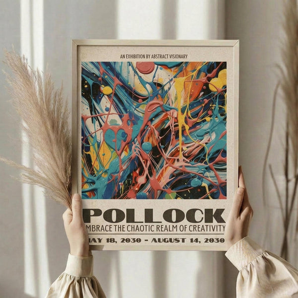 May include: Person holding framed abstract art poster featuring vibrant swirls of blue, orange, yellow, and coral colors in chaotic brushstroke patterns. Text reads "AN EXHIBITION BY ABSTRACT VISIONARY" at top and "POLLOCK" in large letters below artwork, followed by "EMBRACE THE CHAOTIC REALM OF CREATIVITY" and exhibition dates. Light wooden frame against neutral curtained background with dried pampas grass visible on left side.
