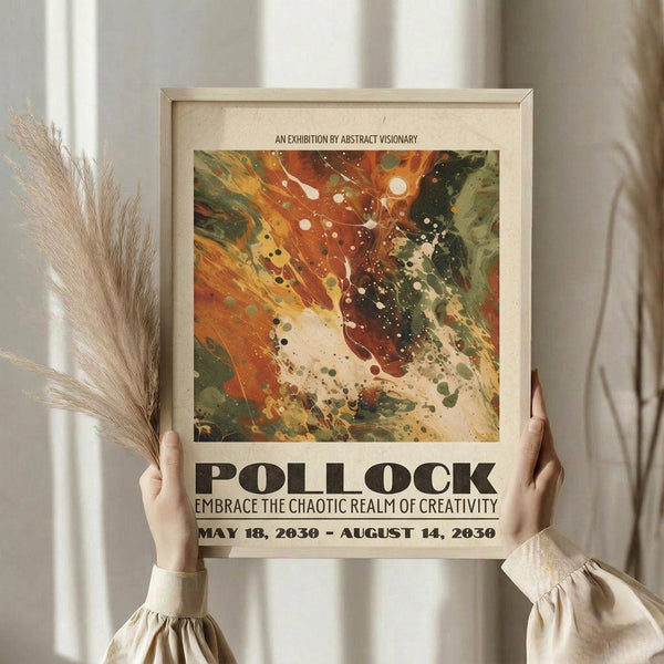 May include: Person holding framed abstract art poster featuring vibrant orange, red, green and cream paint splatters in chaotic dripping style. Poster displays exhibition text for Pollock show dates May-August 2030. Light wood frame against white curtained background with dried wheat stalks visible on left side.