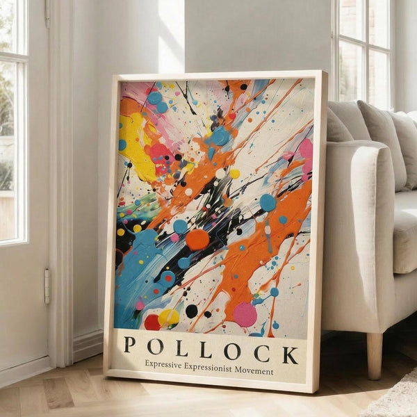May include: Abstract expressionist art poster with vibrant paint splatters and brushstrokes in orange, blue, yellow, pink and black on cream background, displayed in light wooden frame leaning against white wall next to beige upholstered sofa in bright room with large windows and hardwood floors.