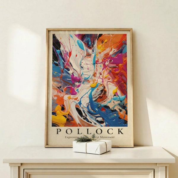 May include: Framed abstract art poster with vibrant swirling paint in blues, oranges, purples, and yellows against white background, displayed on light wood console table next to small wrapped gift with twine and greenery sprig