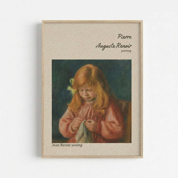 May include: Framed art print on wall showing Renoir painting of young girl with reddish hair and yellow bow sewing white fabric. Girl wears pink dress against dark teal background. Print has cream matting with text identifying Pierre Auguste Renoir and "Jean Renoir sewing" in light wooden frame.
