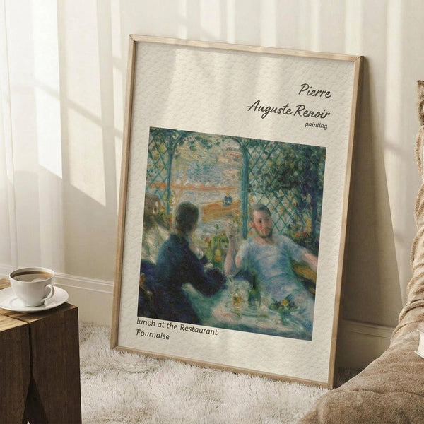 May include: Framed poster print of Renoir's impressionist painting showing two figures dining at a restaurant terrace with latticed windows. The artwork features soft blues and greens with dappled light effects. Light wood frame with white matting, leaning against white wall corner on textured cream rug. Coffee cup on wooden block visible nearby, creating cozy home interior setting with natural window light casting shadows.