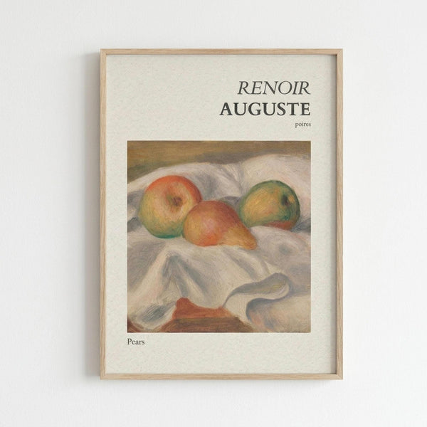 May include: Framed art print displaying Auguste Renoir's impressionist still life painting of three pears in soft red, yellow and green tones resting on white draped fabric. The cream-colored poster features "RENOIR AUGUSTE" and "Pears" text above and below the artwork. Light wood frame mounted on white wall with subtle shadow cast to the right.