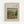 May include: Framed art print displaying Pierre Auguste Renoir's impressionist landscape painting featuring lush green chestnut trees, warm earth tones, and soft brushstrokes. The artwork is matted in cream with black text identifying the artist and title, set in a light wood frame against a white wall.