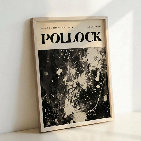 Framed poster featuring Jackson Pollock's abstract expressionist style with black paint splatters, drips, and gestural marks on cream background. Bold "POLLOCK" text at top with "CHAOS AND CREATIVITY" and "1912-1956" details. Light wood frame displayed against white wall, showing the dynamic contrast between dark paint textures and neutral tones.