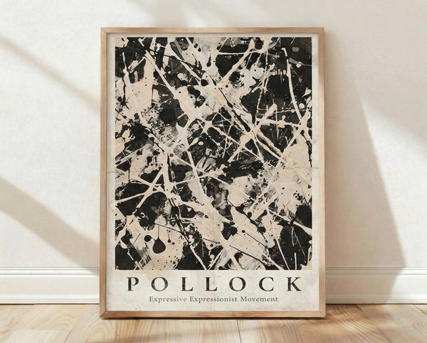 May include: Black and white abstract expressionist artwork in light wood frame, featuring dynamic paint splatters, drips, and gestural brushstrokes across cream background. Text below reads "POLLOCK" and "Expressive Expressionist Movement". Frame leans against white textured wall on light wooden floor with soft natural lighting and shadow patterns.