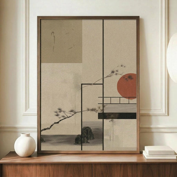 May include: Framed artwork with Japanese-inspired design featuring geometric sections in beige and cream tones, black pine branches, terracotta sun, and dark green landscape elements. Displayed on wooden sideboard beside white ceramic vase and stacked books in elegant room with cream walls and white trim molding.