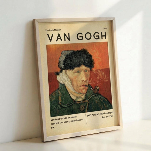 May include: Framed poster print featuring Van Gogh's self-portrait with bandaged ear and pipe against orange background. Shows man in green coat and fur hat. Museum-style layout with cream background, black text reading "VAN GOGH" and artwork details. Light wood frame, displayed leaning against white wall on white surface.