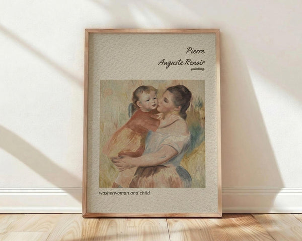 May include: Framed art print leaning against white wall on light wood floor with natural sunlight shadows. Features Pierre-Auguste Renoir's impressionist painting of a woman in white holding a blonde child in orange-red clothing. Warm peachy tones with soft brushstrokes. Text reads "Pierre Auguste Renoir painting" and "washerwoman and child" on beige textured background. Natural wood frame.