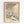 Japanese woodblock print style artwork featuring snow-covered houses with steep roofs nestled among bare winter trees. The scene shows rolling hills in muted beige and brown tones with dark blue-green foliage details. Small birds fly in the overcast sky. The vintage-style poster includes museum attribution text at the top and an artist signature at the bottom. Displayed in a light wood frame against a white wall.
