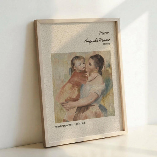 May include: Framed art print leaning against white wall showing Renoir's soft impressionist painting of a woman in earth tones holding a young child. The artwork features warm pastels and loose brushstrokes typical of the artist's style. Text above reads "Pierre Auguste Renoir painting" and below "washerwoman and child." Natural wood frame with light matting, photographed in soft natural lighting.