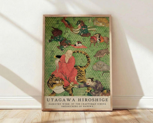 May include: Framed poster print of traditional Japanese artwork featuring a monk in red robes riding a tiger, surrounded by various animals and mythological creatures on a green geometric patterned background. The wooden-framed print leans against a white wall on light wood flooring, with natural sunlight creating soft shadows across the scene.