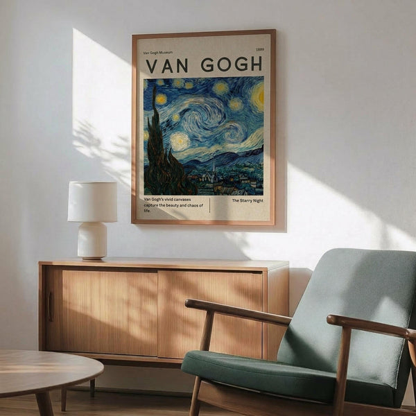 May include: Van Gogh museum poster featuring The Starry Night painting with swirling blue sky and yellow stars, displayed in thin wooden frame above natural wood sideboard. Mid-century modern living room with sage green upholstered chair, white ceramic table lamp, and warm sunlight casting geometric shadows on white wall.