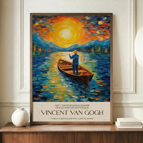 May include: Framed poster displayed on wooden console table featuring Van Gogh-inspired artwork of figure in small boat on swirling blue water with bright yellow sun and colorful sky. Text below reads "Vincent Van Gogh" with French description. White ceramic vase and books flank the brown-framed print against cream wainscoted wall.