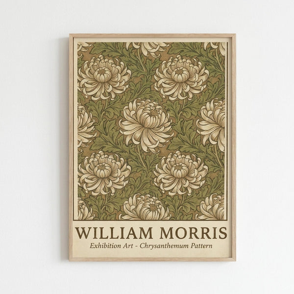 May include: Framed poster with William Morris chrysanthemum pattern featuring cream colored flowers and green foliage on olive background, displayed in light wood frame against white wall. The botanical design shows repeating floral motifs in Arts and Crafts style with detailed petals and leaves.