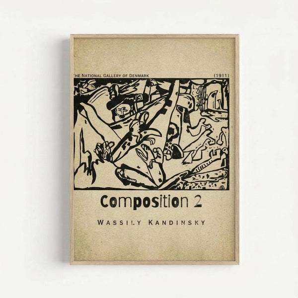 A framed vintage art poster featuring Wassily Kandinsky's abstract black ink composition from 1911. The artwork shows bold, flowing black lines and shapes creating dynamic movement across a cream-colored background. Text at the top reads "The National Gallery of Denmark (1911)" and below the image "Composition 2" and "Wassily Kandinsky." The poster has an aged, beige paper texture and is displayed in a simple light wood frame against a white wall.