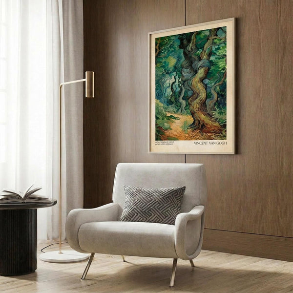 May include: Van Gogh's Cypresses poster print in light wood frame mounted on brown textured wall above beige upholstered armchair with geometric patterned pillow. Modern brass floor lamp and dark round side table with open book nearby. Artwork features swirling green and blue brushstrokes depicting tall cypress trees against turbulent sky in post-impressionist style.