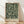 May include: Framed poster with dark green background featuring cream-colored botanical pattern of flowing leaves, branches and small flowers in William Morris style. Natural wood frame leans against white wall on light wooden floor with soft window light creating shadows across the scene.