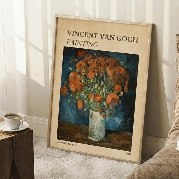 May include: Framed vintage-style art print featuring Van Gogh's vibrant orange poppies in a pale green vase against deep blue background, leaning against white wall corner near wooden side table with white coffee cup, positioned on white textured rug next to beige fabric