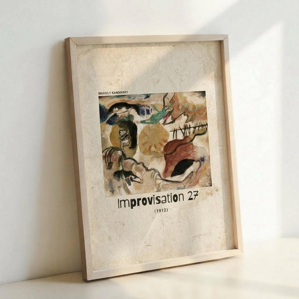 May include: A framed art print leaning against a white wall, featuring Wassily Kandinsky's abstract painting "Improvisation 27" from 1912. The artwork displays swirling organic forms in earthy tones of brown, yellow, green, and black with dynamic brushstrokes. The print is mounted on textured cream paper within a light wooden frame, creating natural shadows on the white surface below.