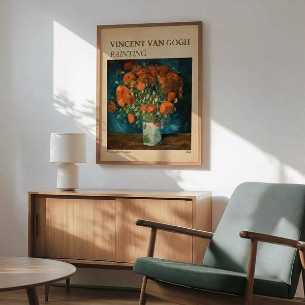 May include: Framed Van Gogh poster print of orange poppies in a pale green vase against a dark blue background, displayed above a mid-century modern wooden credenza with sliding doors. Scene shows mint green upholstered armchair with wooden frame, small round coffee table, and white ceramic table lamp. Warm natural lighting creates shadows across white walls in contemporary living room setting.