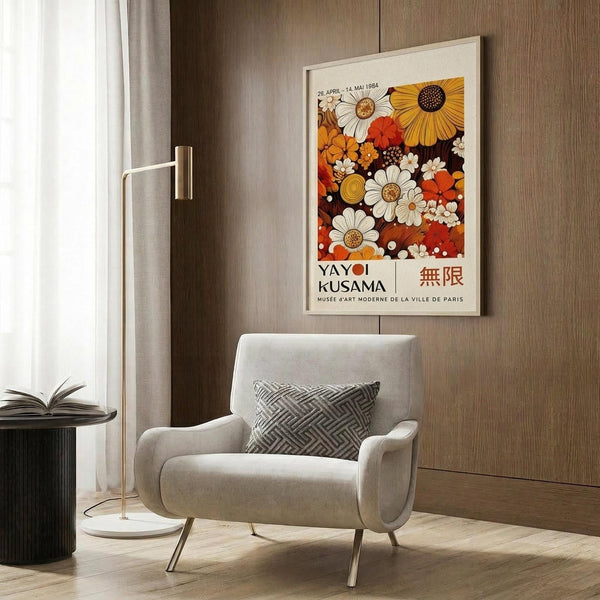 a cozy living room with a white armchair, a floor lamp, and a framed poster of a floral design on the wall.
