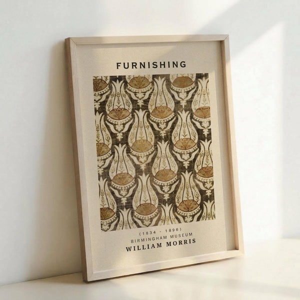 May include: Framed poster print featuring William Morris decorative pattern in earth tones of brown, cream, and gold. The intricate Victorian-style design shows repeating ornamental motifs with flowing organic shapes. Light wood frame displayed against white wall, leaning on surface, showing museum exhibition details and Morris's dates (1834-1896).