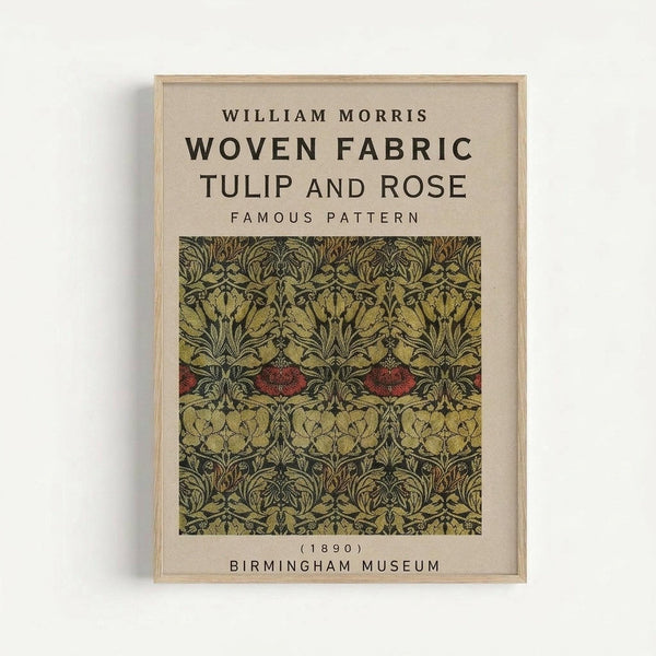 Framed vintage textile design poster featuring William Morris's Tulip and Rose pattern from 1890. The artwork displays an intricate repeating motif of stylized tulips and roses in muted greens, golds, and deep red accents on a cream background. Text identifies the designer, pattern name, date, and Birmingham Museum attribution. The print is mounted in a simple light wood frame against a white wall.