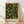 May include: Framed botanical art print featuring William Morris fruit pattern design with peaches, lemons, and berries on dark background, displayed against white wall on light wood floor. Natural wood frame contains vintage-style artwork with lush green foliage and colorful fruits in decorative Arts and Crafts movement style.