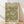 May include: Framed botanical poster with green and cream floral pattern leaning against white wall on light wood floor. Natural wood frame surrounds vintage-style design featuring detailed flowers and leaves. William Morris gallery exhibition text at top with quote at bottom. Soft natural lighting creates gentle shadows on textured white wall.