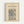 May include: Framed vintage botanical wallpaper design print in light wood frame hanging on white wall. Features intricate blue and beige floral pattern with flowing vines, leaves, and ornate Victorian-style motifs. Typography at top displays designer name, pattern name, year 1890, and location Birmingham in dark blue text on cream background.