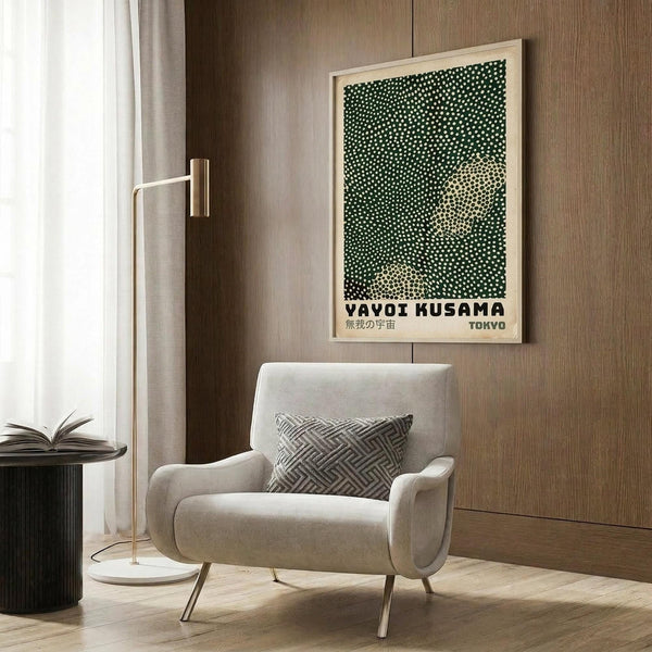 a modern living room with a white armchair, a floor lamp, and a framed poster on the wall.