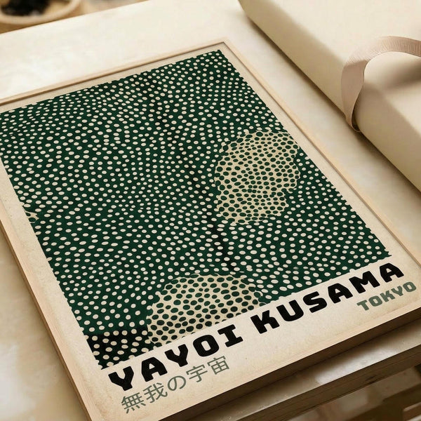 A framed poster with a green and white polka dot pattern, featuring the text "YAYOI KUSAMA TOKYO" and some Japanese text below it.