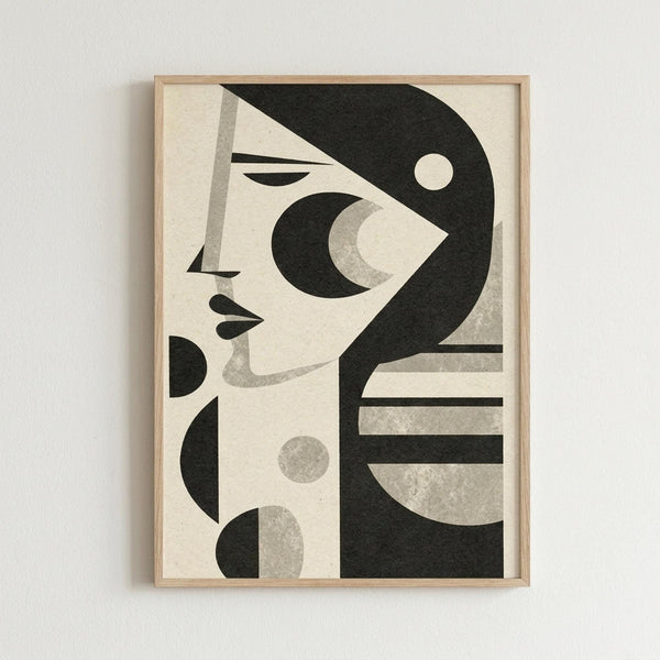 May include: Framed abstract geometric artwork hanging on white wall, featuring stylized woman's profile in black and cream tones with circular and curved shapes, displayed in light wood frame