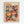 Framed poster featuring colorful illustrated mushrooms in various sizes with polka dot patterns in red, orange, green, pink, and yellow tones against a black background. Text reads "YAYOI KUSAMA" in red letters at top with Japanese characters, and "1988" and "UDOG GALLERY • EXHIBITION ART" at bottom. Light wooden frame on white wall.