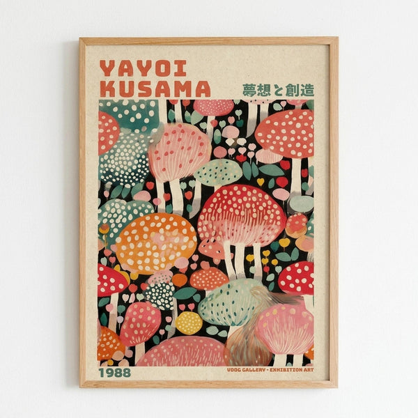 Framed poster featuring colorful illustrated mushrooms in various sizes with polka dot patterns in red, orange, green, pink, and yellow tones against a black background. Text reads "YAYOI KUSAMA" in red letters at top with Japanese characters, and "1988" and "UDOG GALLERY • EXHIBITION ART" at bottom. Light wooden frame on white wall.