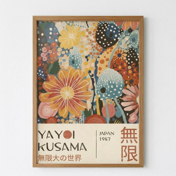 Framed poster featuring vibrant abstract floral artwork with large orange and yellow blooms, polka-dotted patterns in blue and teal, and colorful organic shapes against a cream background. Below the artwork is text reading "YAYOI KUSAMA" with "JAPAN 1987" and Japanese characters, along with red geometric symbols. The poster is displayed in a natural wood frame against a white wall.