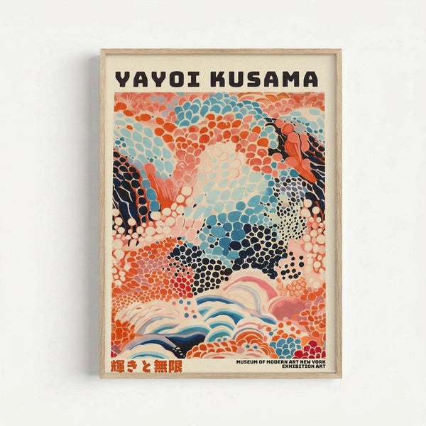 Colorful abstract art poster with polka dot patterns in orange, blue, black and coral tones, featuring flowing organic shapes and wave-like elements at bottom. Bold black text at top reads "YAYOI KUSAMA" with Japanese characters below. Small text indicates Museum of Modern Art New York exhibition. Displayed in light wooden frame against white wall.