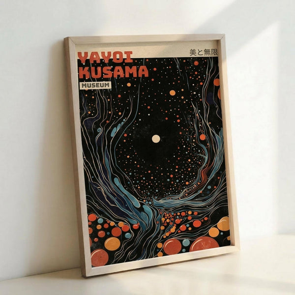 Framed poster featuring a cosmic swirling design in black, orange, blue and cream colors. The artwork shows flowing organic shapes creating a circular vortex pattern filled with scattered dots and circles of varying sizes. Red text at top reads "YAYOI KUSAMA" with "MUSEUM" below and Japanese characters in upper right corner. The print has a psychedelic, space-like appearance with flowing lines and polka dot elements. Light wood frame against white wall background.