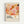 Framed abstract art print featuring organic flowing shapes in warm tones of coral, orange, pink, peach, and burgundy with scattered dots throughout. The artwork has a dreamy, fluid composition with overlapping curved forms. Below the colorful design is text reading "YAYOI KUSAMA" with Japanese characters and "永遠に続く愛 | MUSÉE d'ART MODERNE DE LA VILLE DE PARIS" on a cream background. The print is displayed in a light wood frame against a white wall.