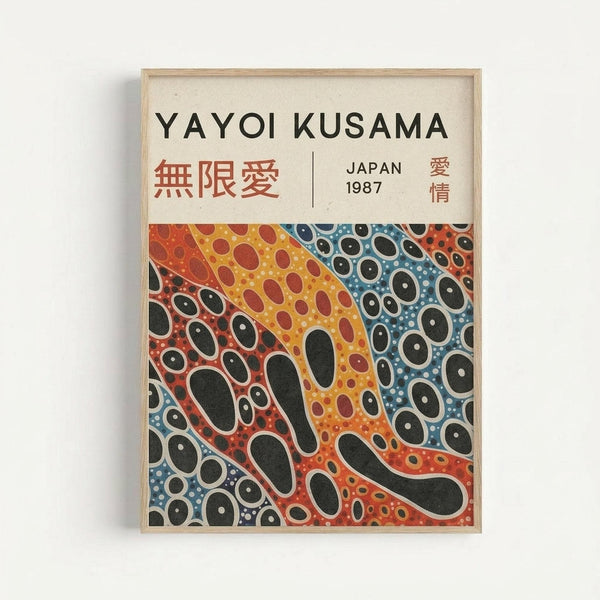 A framed art print featuring Yayoi Kusama's distinctive polka dot style with flowing organic shapes in vibrant orange, red, yellow, and blue colors. The artwork contains countless black circular dots of varying sizes scattered across undulating wave-like forms. Text at the top reads "YAYOI KUSAMA" with Japanese characters and "JAPAN 1987" below. The print is displayed in a simple light wood frame against a white wall, showing the cream-colored paper background and bold, psychedelic p