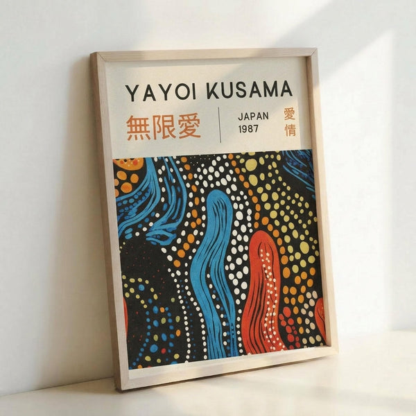May include: Framed poster print featuring abstract flowing design with blue and red curved shapes on black background, surrounded by colorful dots in white, orange, and yellow. Japanese characters appear in orange text at top, with "JAPAN 1987" text alongside. Light wooden frame sits propped against white wall.