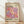 May include: Framed poster with cream background featuring colorful overlapping circles in purple, pink, orange, and coral tones. Text reads "YAYOI KUSAMA" in purple and black letters, "TOKYO 1998" in upper right, and Japanese characters at bottom with "22 APRIL 1986" and "MUSEE D'ART MODERNE DE LA VILLE DE PARIS." Natural wood frame sits on light wooden floor against white wall with soft shadows.